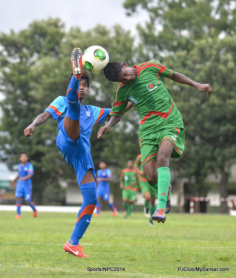 Players from Bangladesh and India struggle it out for possession of the ball. Photo: Pemba Sherpa 