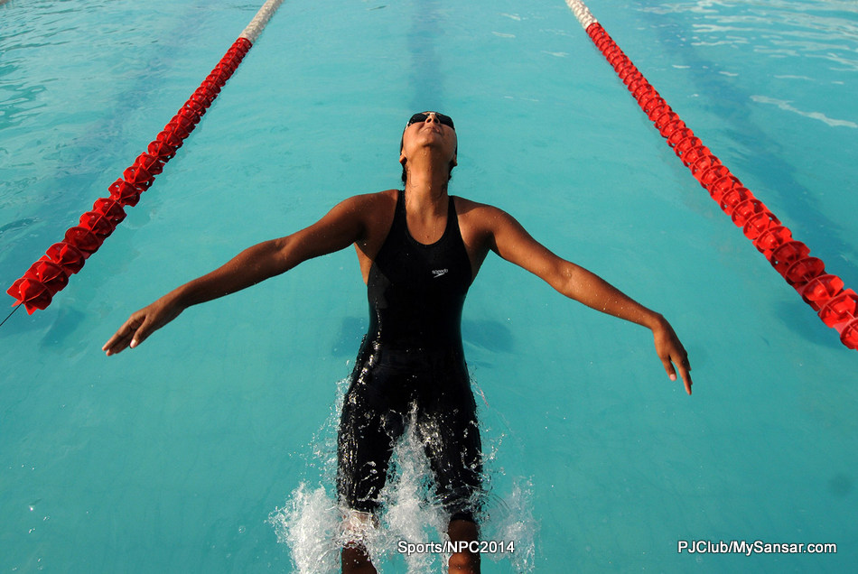 Shaila Rana takes a dive as she competes in the 100m backstroke category during the NSA Cup National Open and Age Group Swimming Tournament. Photo: Dipesh Shrestha 