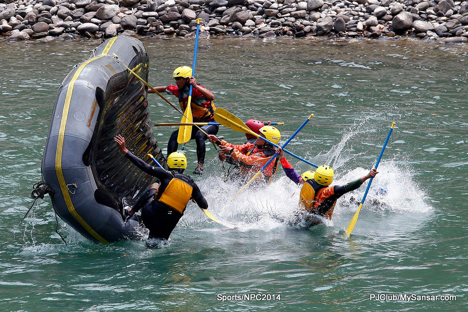 River guide trainees practice raft flip drills during a white water rafting course in the Sunkoshi River. Nepal is a popular destination for water adventure sports. Photo: Kiran Panday. 