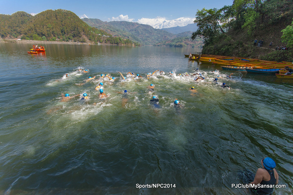 A participant takes her time before taking a dive in the Begnas Taal during the Himalayan Rush International Triathlon Championship. Photo: Nischal Oli 
