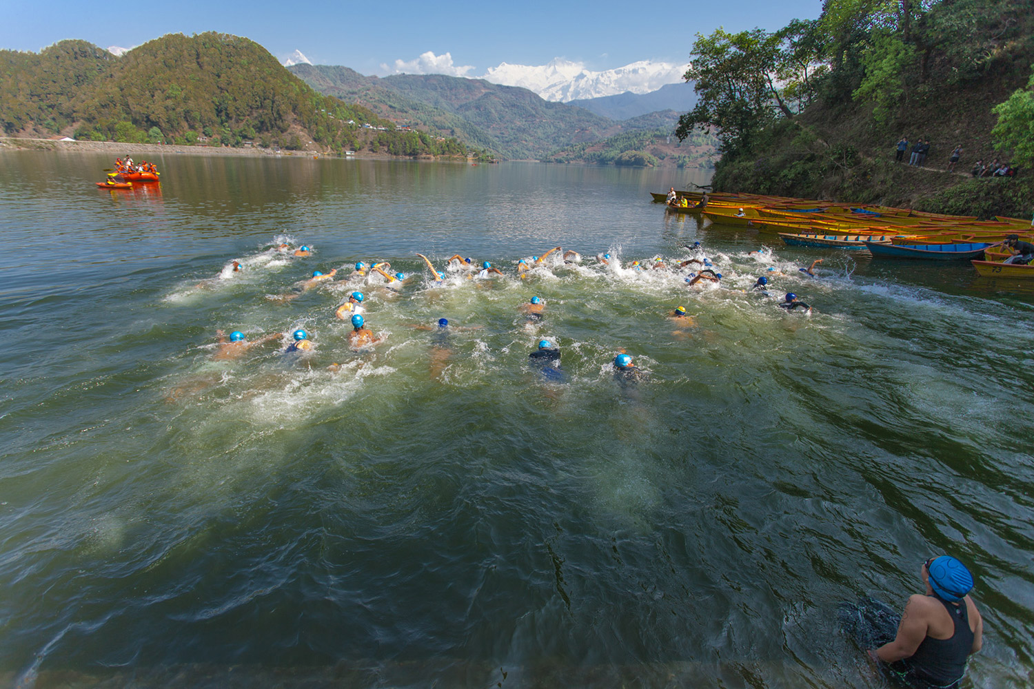 A participant takes her time before taking a dive in the Begnas Taal during the Himalayan Rush International Triathlon Championship. Photo: Nischal Oli 