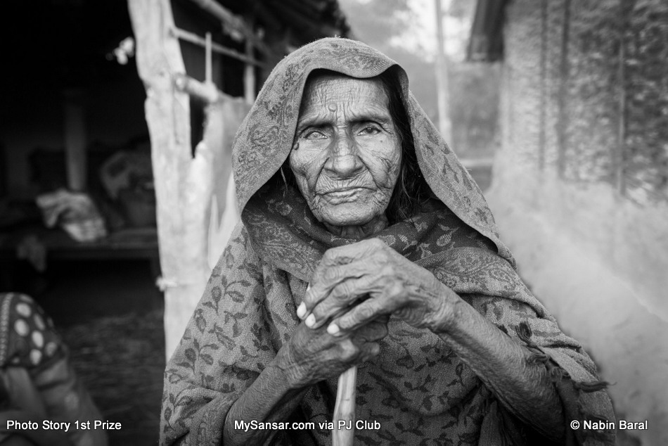 Kanti Yadav, a 103 year old widow from a village of Janakpur  Dristrict. The Dhami of the same village blames Brikeah Yadav’s illness on her.  November 5 2014, Janakpur, Nepal.