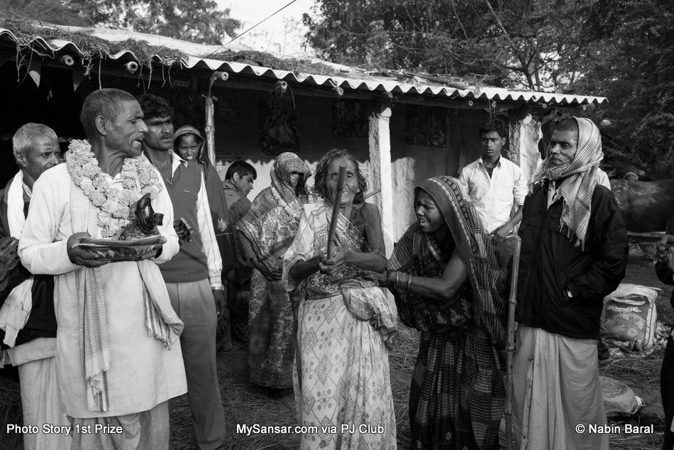 Kanti Yadav, a 103 year old widow from a village of Janakpur  Dristrict, hit herself with as stick as she felt the humilation due to the accusion of being a witch. The Dhami of the same village blames Brikeah Yadav’s illness on her.  November 5 2014, Janakpur, Nepal.