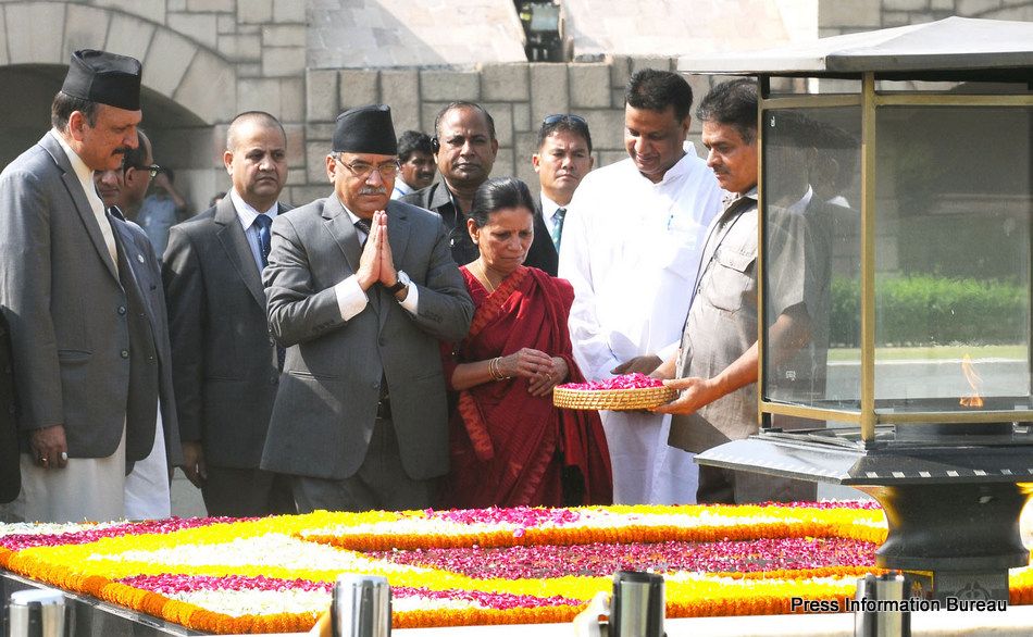The Prime Minister of Nepal, Mr. Pushpa Kamal Dahal paying homage at the Samadhi of Mahatma Gandhi, at Rajghat, in Delhi on September 16, 2016.